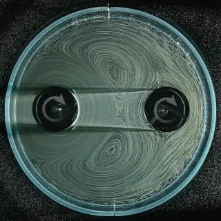 Gears Without Teeth: Fluid Flows Spin Rotors in a Noncontact Engine