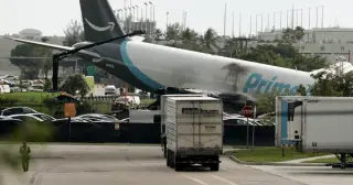 Amazon cargo jet overruns Miami runway, collides with roadside vehicles