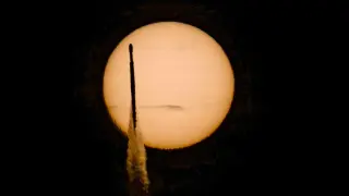Sunrise Shot Captures NASA's Nancy Grace Roman Telescope Crossing the Sun During SpaceX Falcon Heavy Launch