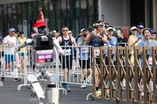 Humanoid robot edges past humans to claim half-marathon record in Beijing