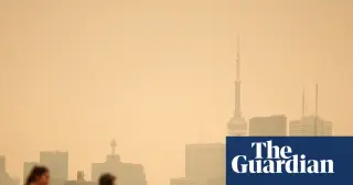 Drifting U.S. wildfire smoke prompts Canadian air warnings as tariff talk flares