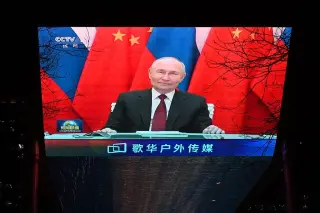 Russia strikes Chinese-owned cargo ship near Odesa as Putin heads to Beijing