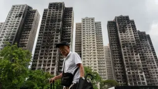 Hong Kong Chief Executive Apologizes as Housing Secretary Resigns Over Deadly Fire