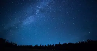 Brighter Skies, Shorter Distances: The Night Sky of the First Life