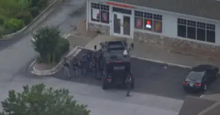 Stolen-car standoff ends with arrest at Newnan Dunkin’