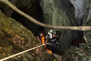 Laos rescuers search new route to reach two trapped in flood-hit cave