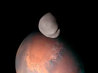 Deimos’s Deep Past: New Simulations Point to an Ancient Asteroid Impact