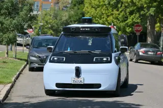 Waymo driverless car cruises through Denver farmers market