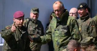 Merz Keeps Cool on Trump Rift Over Troops and Trade