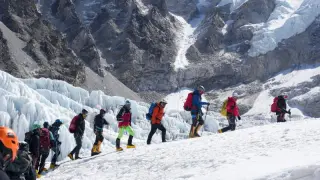 Glacial block stalls Everest push as base camp braces for crowds