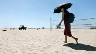 Western heat wave tightens its grip, threatening record temps for millions