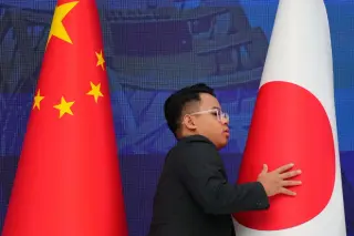 China tightens export rules on a key chipmaking material, drawing Japan’s protests