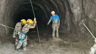 Rescued from flood-hit Nepali hydro tunnels as search for missing workers continues