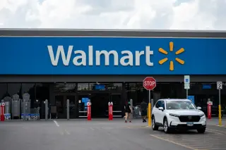 Walmart lifts full-year outlook, but shares slip on softer U.S. same-store sales