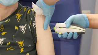 AI-crafted universal coronavirus vaccine clears first-in-human trial