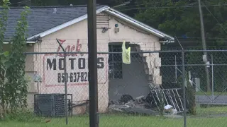 Car slams into Pensacola used-car dealer after tearing through fence