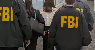 FBI raids home of suspected Chinese spy's accomplice as accused realtor denied bail