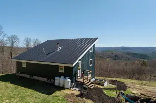 Sun-powered Vermont retreat on 52 acres blends privacy with mountain views