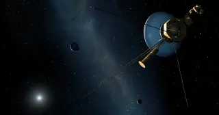 Car-sized Voyager 1 keeps moving outward past Pluto, outlasting its builders