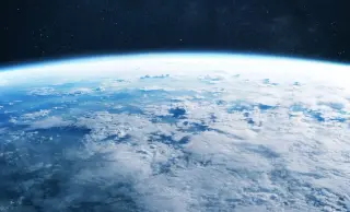 CO2's paradox: surface warming, stratospheric cooling explained