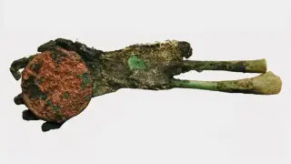 Green Relic Hand: Copper Coin Preserves 150-Year-Old Hungarian Infant