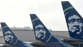 Alaska Airlines flight returns to gate after on-board threats trigger cockpit lockdown
