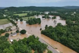 Missouri floodwaters trigger mass helicopter rescues at summer camp; one dead