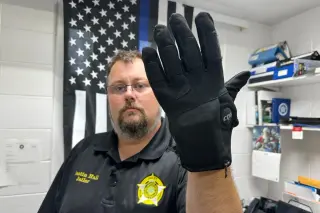 ICE bets on electric gloves to curb force in custody**