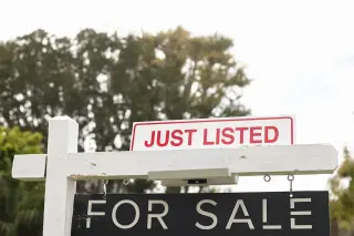 July housing cools as mortgage costs pressure buyers