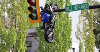 Motorcycle Suspended From Vancouver Traffic Light After Crash