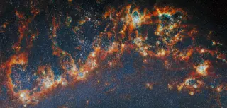 Massive star clusters escape birth clouds first, sparking early UV glow in galaxies