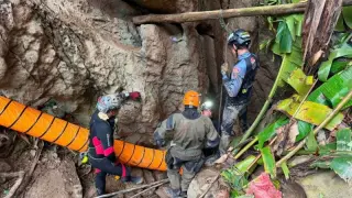 Laos cave rescue makes progress as first survivor exits and teams push to save five