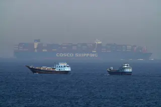 Iranian Strikes Sink Two Ships in Hormuz as Oil Flows Drop 40%
