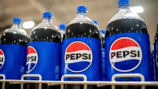 PepsiCo cuts profit forecast but raises revenue outlook as sales momentum improves