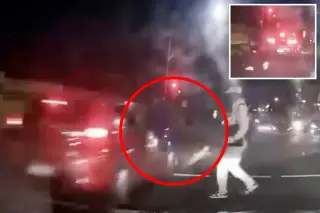 Sydney dashcam captures pedestrian walking away after red-light crash