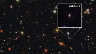 Ancient galaxy emits ionizing light, piercing the early universe's fog