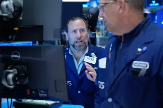 Oil eases under $98 as markets cling to records and banks stumble