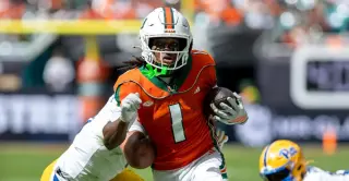No. 1 Miami Crushes Pitt 52-23 as Toney Sets Record in 2001 Team Tribute