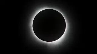 Partial eclipse arrives for Michigan as totality shadows distant skies