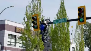 Delta, BC Motorcycle Ends Up Dangling from Traffic Light After Crash