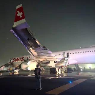 Passengers Evacuate Swiss Flight After Engine Failure, Snap Selfies While Carrying Bags