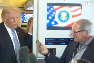 Trump accuses reporter of treason on plane from China after Iran question