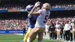 Purdy, Evans lift 49ers in Melbourne with three TDs