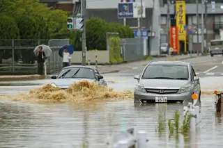 Stormy rains lash north-central Japan, triggering floods and landslides