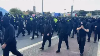 Masked demonstrators halt traffic into Dover port amid anti-immigrant protest