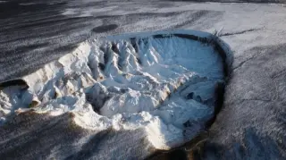 Siberia's Expanding Megaslump Reveals Ice-Age Remains and Climate Clues