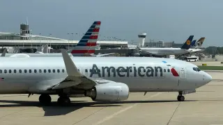 AA ends free elite upgrades on select long domestic flights