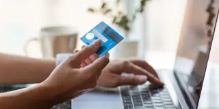When loneliness meets status: a path to online shopping addiction