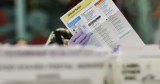 States sue to halt USPS mail-ballot rule amid election-time showdown