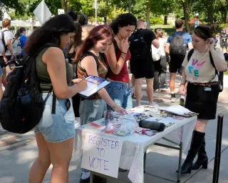 Registration surge in battleground states lifts Democratic hopes for November